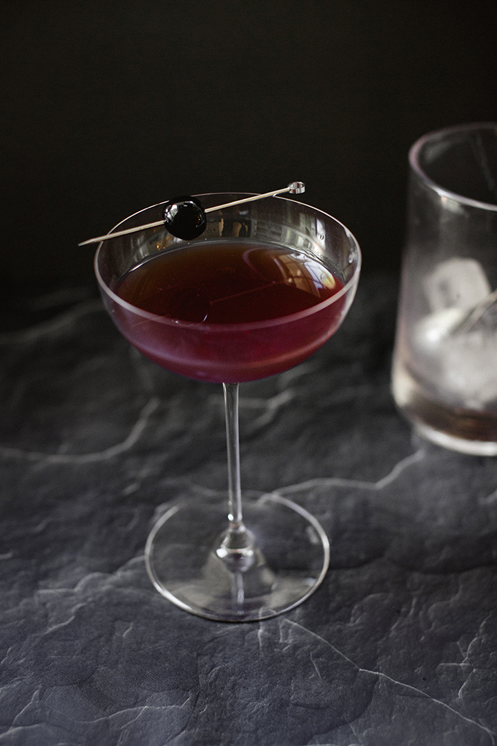 Four Unique Holiday Cocktail recipes for your next winter gathering by Reverie Cocktails and Amy Rae Co.  Winter Gin and Tonic, Bourbon Punch, Rye Manhattan, Vodka-sour Aperol.