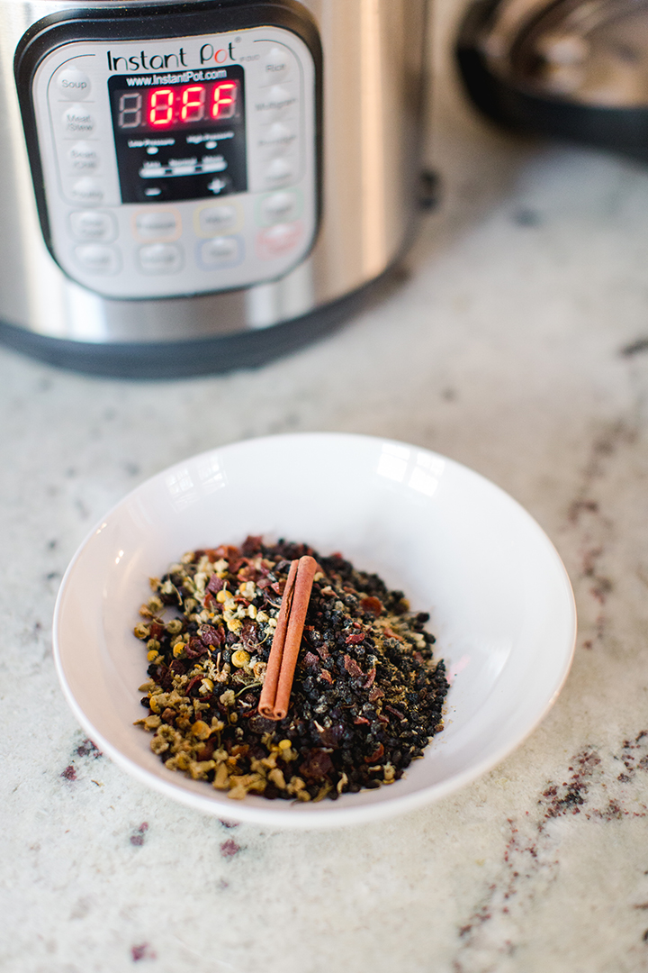 Instant Pot Elderberry Syrup Recipe to Boost Immunity. High in antioxidants, supports immune system, and anti-inflammatory.  Dried herb recipe easy to keep on hand for whenever you want to make a batch.  Quick instant pot recipe for easily making a batch of immune supporting elderberry syrup.